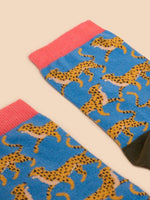 White Stuff Cheetah Ankle Socks with a colourful cheetah design, black toe and heel, and White Stuff printed on the sole