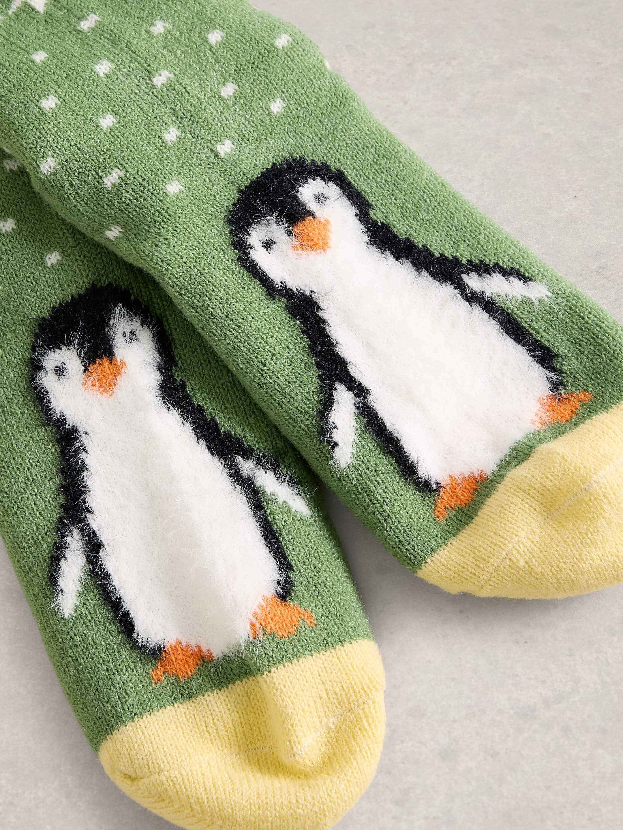 An image of the White Stuff Fluffy Penguin Cabin Socks