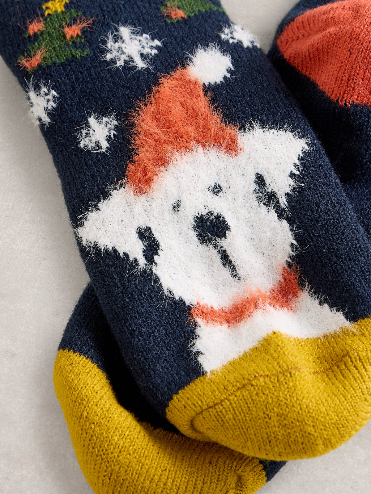 An image of the White Stuff Christmas Dog Cabin Socks