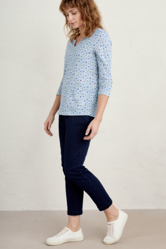 An image of a model wearing the Seasalt Gypsophilia Notch Neck Top in the colour Shaded Flowers Chalk.