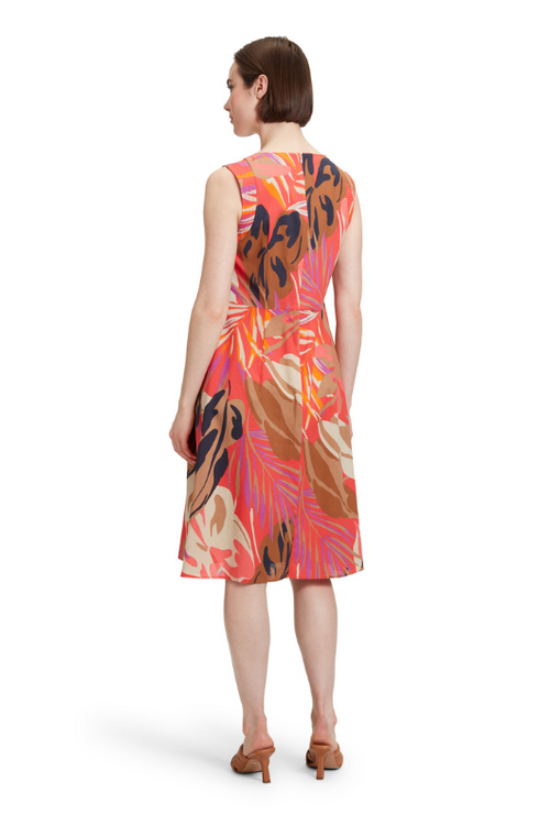 An image of a model wearing the Betty Barclay Leaf Pattern Dress in the colour Red/Beige.