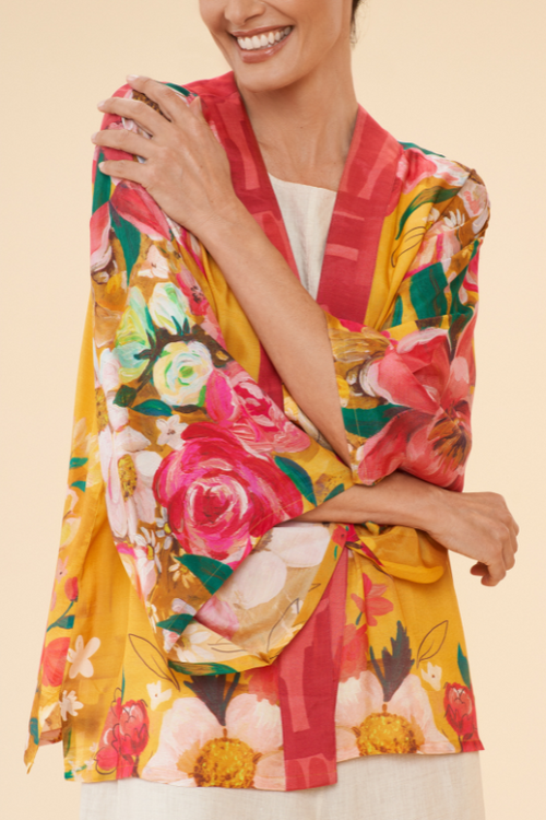 Powder Kimono Jacket. A hip-length, open style jacket with a bright mustard floral print