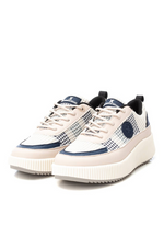 Xti Trainer. A woven, women's sneaker with a non-slip rubber sole, 3cm platform, and a navy & cream design.