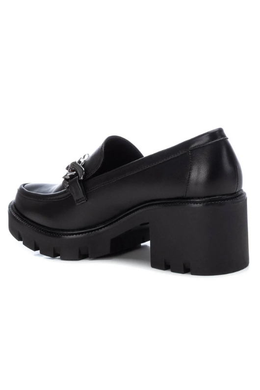 Xti Chunky Heel Loafer. A black vegan leather loafer with chain detail and chunky heeled sole.