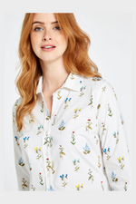 Dubarry Highland Blouse. A feminine, floral blouse with front button placket, curved hem, and a smart spread collar