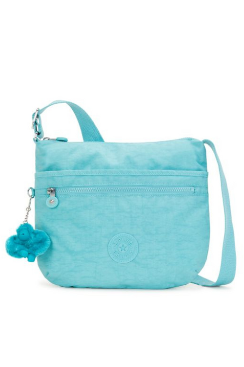 Kipling Arto Crossbody Bag. An aqua crossbody bag with multiple compartments, zip closure, and Kipling logo/monkey charm.