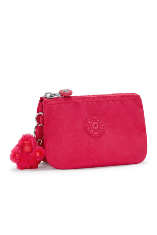 Kipling Creativity S Purse. A small zip purse in vibrant pink with a round Kipling logo on the front and a fluffy Kipling monkey keychain.