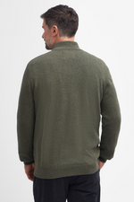 An image of a male model wearing the Barbour Whitfield Half-Zip Jumper in the colour Olive.