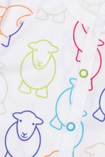 An image of the Herdy Company's Baby Marra Sleepsuit with colourful sheep outlines all-over.