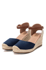 Xti Wedge Sandal. Women's espadrille wedge sandals with a navy, microfibre faux suede upper, a faux leather strap, a 7cm jute wedge and a non-slip rubber sole.