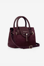 Fairfax & Favor The Mini Windsor. A mini windsor handbag with crossbody strap and tassel details. Suede and leather in the colour Plum.