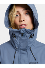 Didriksons Thelma Parka 10. A fully waterproof and windproof jacket with a feminine drawstring waist, pockets, a two-way adjustable hood, and front zip fastening