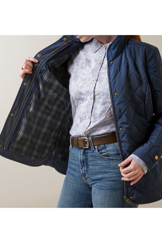 An image of a female model wearing the Ariat Woodside Jacket in the colour Navy.