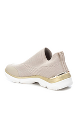 Xti Slip-On Trainer. A sock-style, women's sneaker with a back pull for easy put on, a non-slip rubber sole, a beige mesh upper and gold detail on the sole
