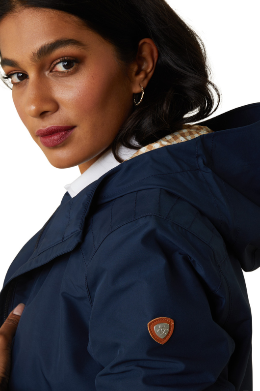 An image of a female model wearing the Ariat Atherton H20 Jacket in the colour Navy.