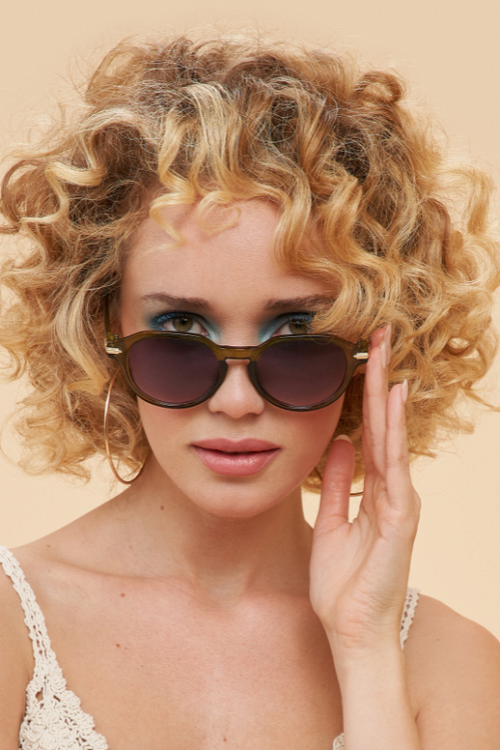 Powder Lara Sunglasses. Bold, classic shaped sunglasses with a chic olive frame.