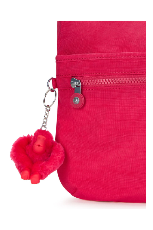 Kipling Arto Shoulder Bag. An across body bag in vibrant pink with an outer zip pocket, round Kipling logo on the front and a Kipling fluffy monkey keychain.