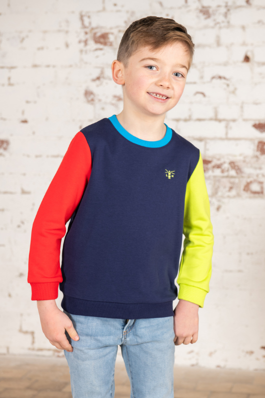 Lighthouse Finn Jersey. A boys sweatshirt with a crew neckline, a navy torso with one red sleeve and one lime sleeve.