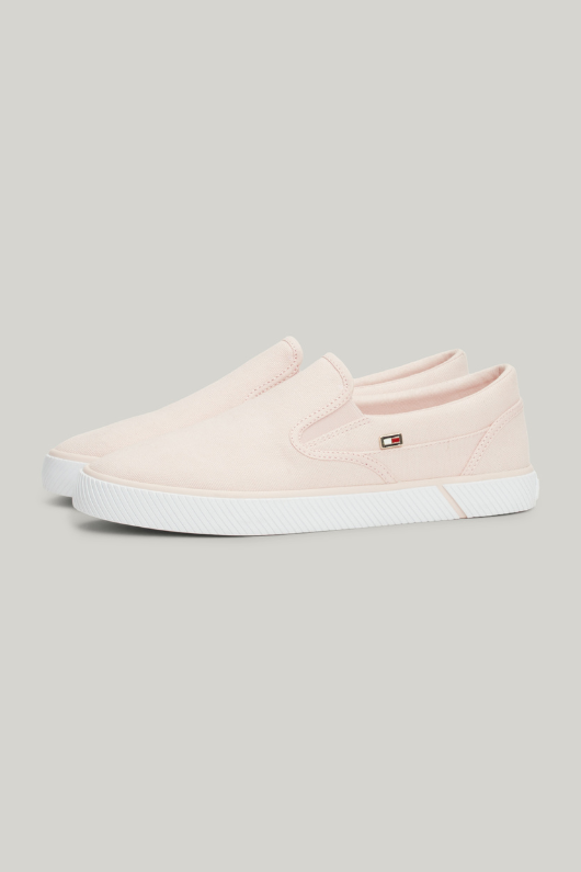 An image of the Tommy Hilfiger Enamel Flag Slip-On Canvas Trainers