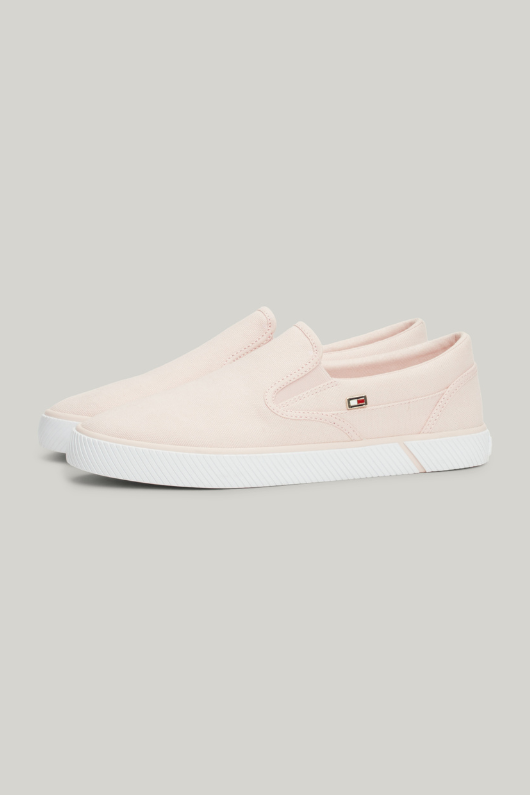 An image of the Tommy Hilfiger Enamel Flag Slip-On Canvas Trainers in the colour Whimsy Pink.