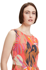 An image of a model wearing the Betty Barclay Leaf Pattern Dress in the colour Red/Beige.