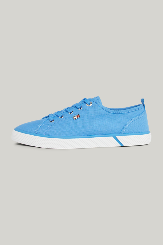 An image of the Tommy Hilfiger Enamel Flag Canvas Trainers in the colour Blue Spell.