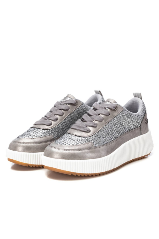 Xti Trainer. A silver, metallic effect trainer with lace-up closure, a textured finish, and a 4cm platform sole