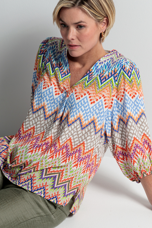 An image of a female model wearing the Bianca Alena Blouse in the colour Multi.