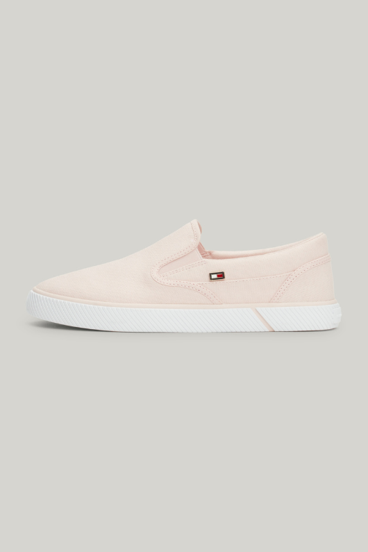 An image of the Tommy Hilfiger Enamel Flag Slip-On Canvas Trainers in the colour Whimsy Pink.