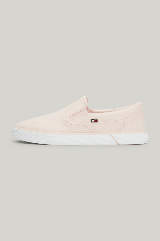 An image of the Tommy Hilfiger Enamel Flag Slip-On Canvas Trainers