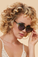 Powder Lara Sunglasses. Bold, classic shaped sunglasses with a chic olive frame.