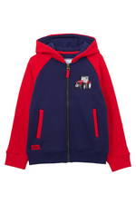 Lighthouse Jackson Full Zip Hoodie. A boys zip-up hoodie with waist pockets, a soft jersey lined hood, and a a navy torso with a tractor piqué on the chest and red sleeves.