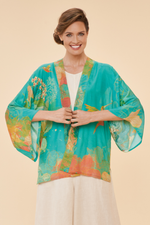 Powder Kimono Jacket. A hip-length, open style jacket with a bright blue floral print
