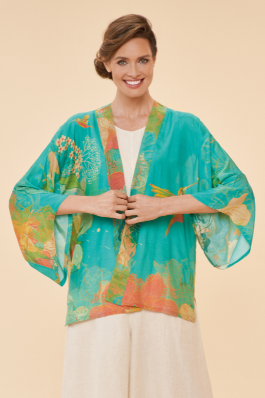 Powder Kimono Jacket. A hip-length, open style jacket with a bright blue floral print