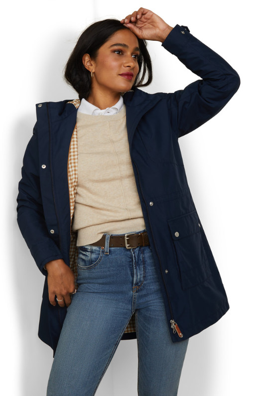 An image of a female model wearing the Ariat Atherton H20 Jacket in the colour Navy.