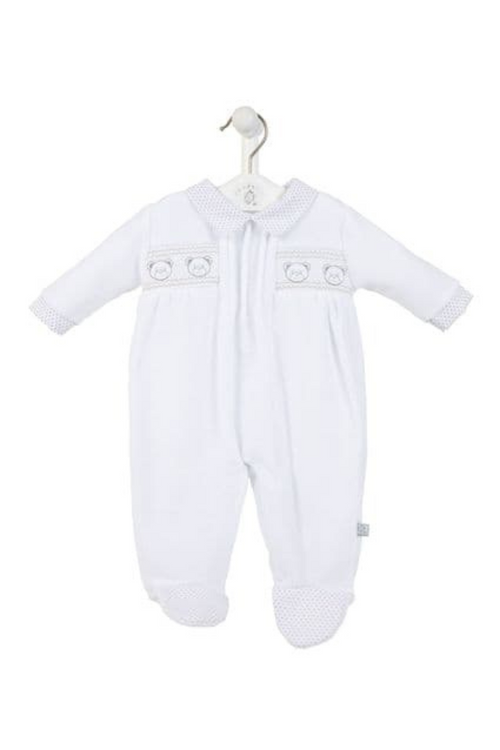 Dandelion Baby Bear Smock Sleepsuit. A long sleeve, collared sleepsuit with smocked detail and bear appliques. This sleepsuit is in a white shade.