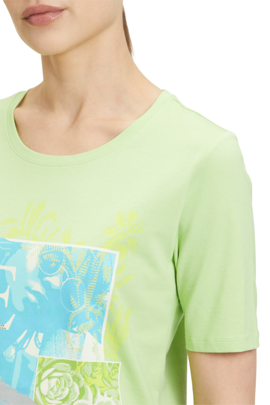 An image of a female model wearing the Betty Barclay Basic T-Shirt in the colour Green Mint.
