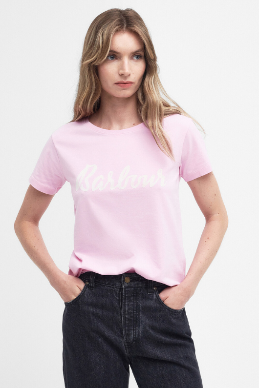 An image of a female model wearing the Barbour Otterburn T-Shirt in the colour Pink.