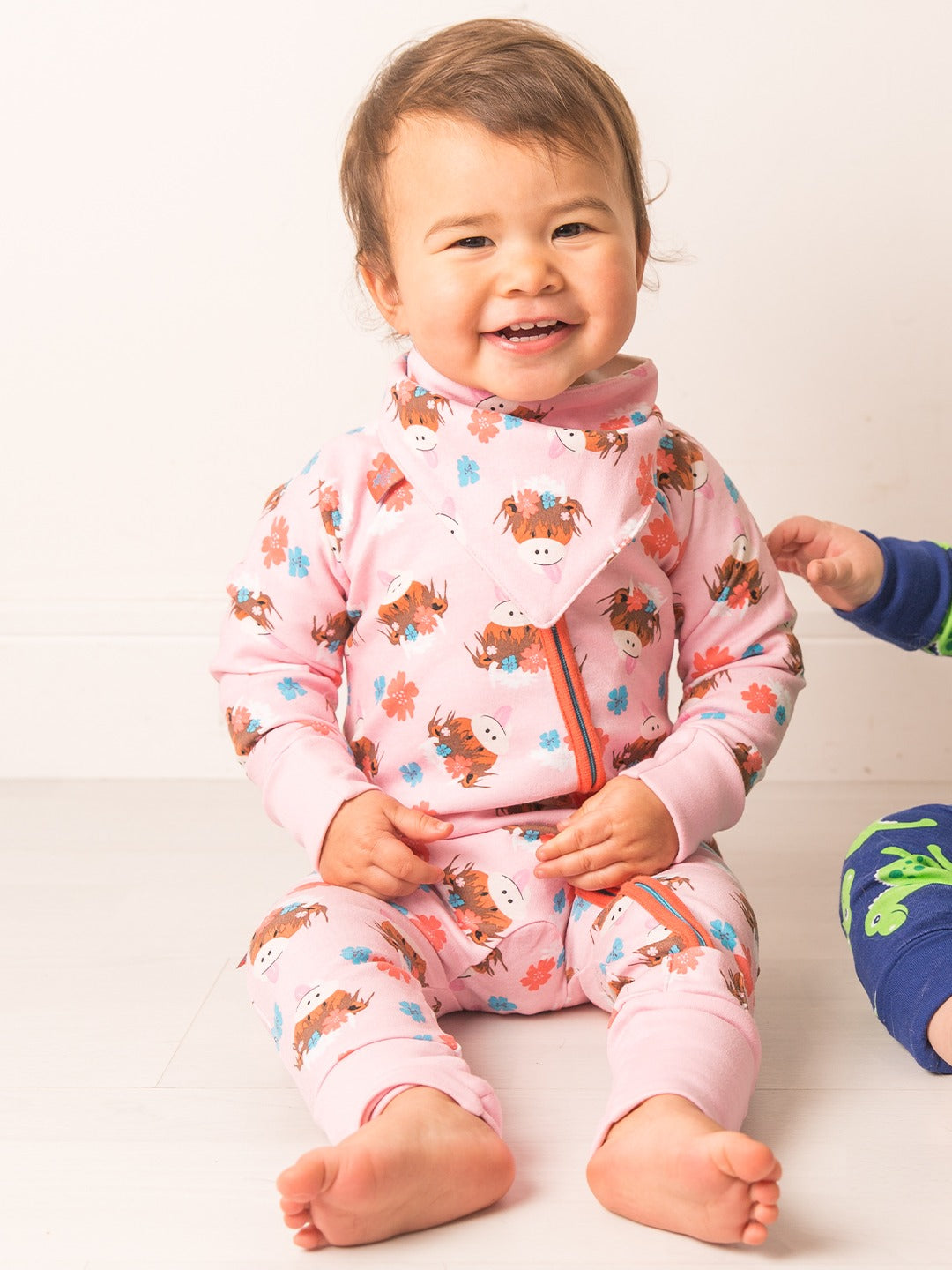 An image of the Blade & Rose Bonnie Highland Cow Zip Up Romper