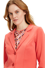 An image of a model wearing the Betty Barclay Jersey Blazer Jacket in the colour Cayenne.