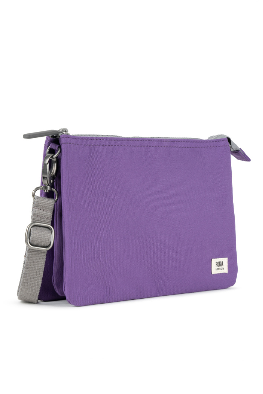 An image of the Roka London Carnaby Crossbody XL Imperial Purple Recycled Canvas Bag.