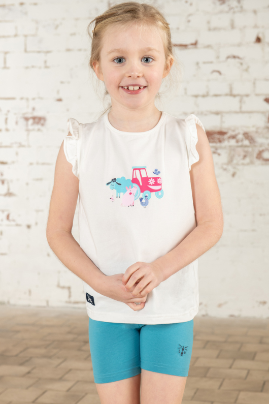 Lighthouse Causeway Swing Tee. A regular fit, kids t-shirt with short ruffle trim sleeves, a crew neck, and a tractor & animal design on a white background.