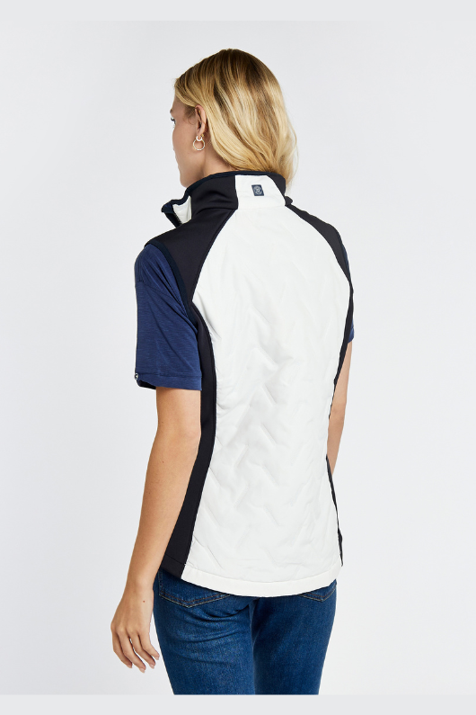 Dubarry Redbarn Gilet in White with Navy detail on the sides. A zip-up gilet with a dipped back hem and rib knit cuff detail