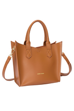 Every Other Twin Strap Grab Bag. A tan faux leather bag with top handles, crossbody strap and removable pouch.