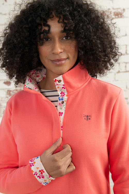 Lighthouse Haven Jersey Sweatshirt. A relaxed fit sweatshirt with a cosy funnel neck with half front popper fastening and a pretty floral lining