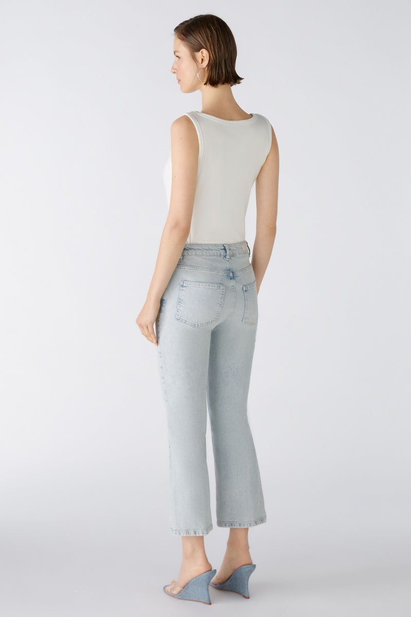 An image of a female model wearing the Oui Faded Look Jeans in the colour Blue Denim.