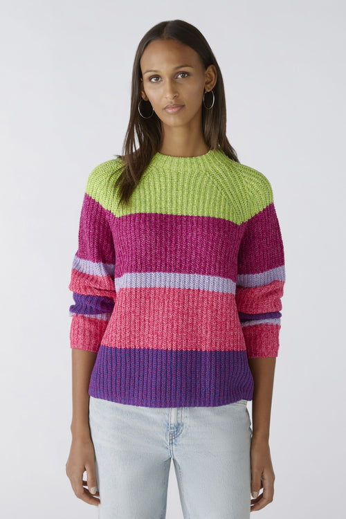 Oui Broad Stripes Jumper. An oversized fit jumper with shortened length. This jumper has long sleeves, round neckline, and a multi-coloured green, pink and purple striped pattern.