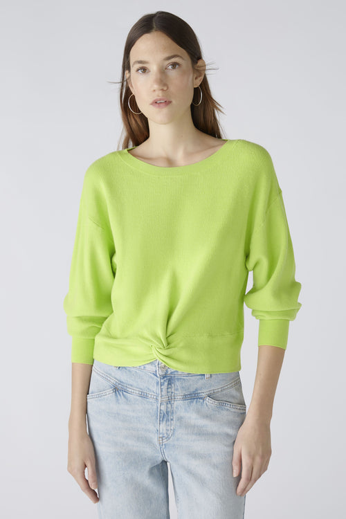 Oui Rouched Waistband Jumper. A narrow cut, long sleeve jumper with round neck and knot hem detail. This jumper is in a bright green shade and has ribbed detail. 