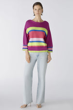 Oui Tie Sides Jumper. This jumper has a casual cut and regular length, alongside 3/4 length sleeves, round neck with overcut shoulder, tie side detail, and a bold striped print in pink, purple, blue and green.