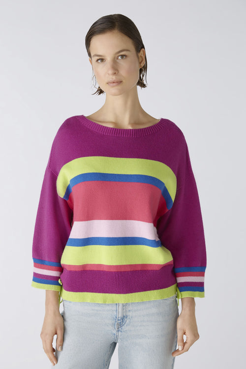Oui Tie Sides Jumper. This jumper has a casual cut and regular length, alongside 3/4 length sleeves, round neck with overcut shoulder, tie side detail, and a bold striped print in pink, purple, blue and green.
